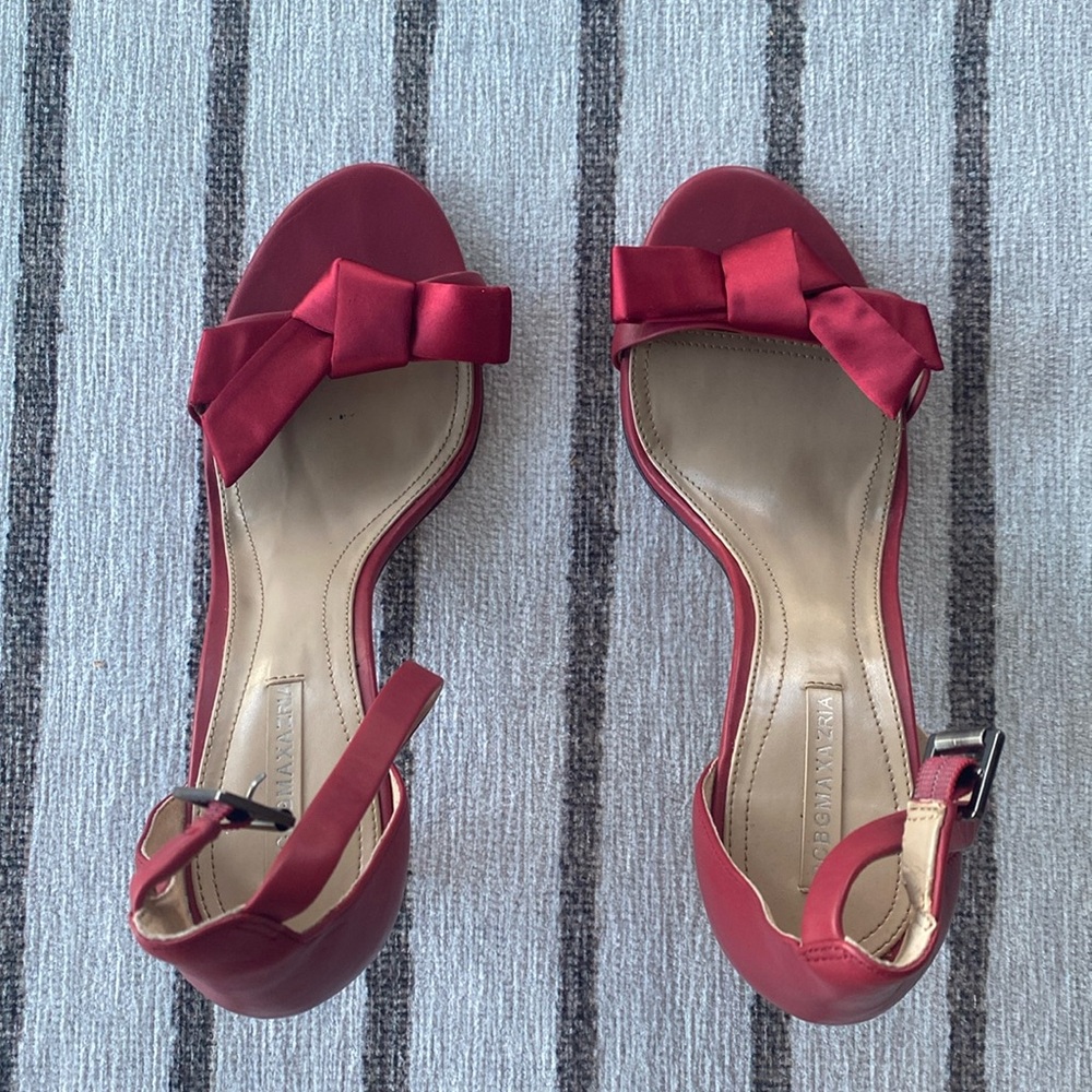 Red BCBG MaxAzria high heel sandals.